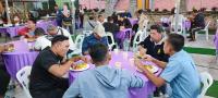 a group of people sitting at tables eating food at Tekoma Resort Cameron Highlands in Tanah Rata
