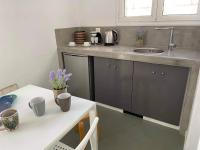 Kuchyň nebo kuchyňský kout v ubytování Sabbia Calda Apartments
