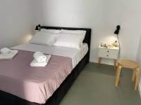 Postel nebo postele na pokoji v ubytování Sabbia Calda Apartments