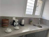 Příslušenství pro přípravu čaje a kávy v ubytování Sabbia Calda Apartments