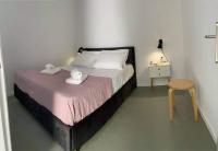 Postel nebo postele na pokoji v ubytování Sabbia Calda Apartments