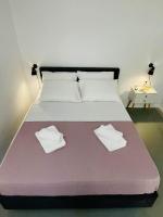Postel nebo postele na pokoji v ubytování Sabbia Calda Apartments