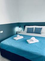Postel nebo postele na pokoji v ubytování Sabbia Calda Apartments