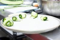 a white plate with sliced avocados on it at Ventura Santa Teresa in Santa Teresa Beach