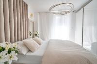 Posteľ alebo postele v izbe v ubytovaní SZAFIROWE APARTAMENTY 1 kryty basen i sauna RESORT KLIFOWA