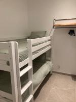 Uma ou mais camas em beliche em um quarto em Vakantiehuis En Passant