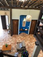 a living room with a couch and a table at Pousada Estrela do Mar in Maresias