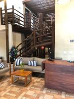a lobby with a couch and a christmas tree at Pousada Estrela do Mar in Maresias