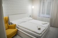 Łóżko lub łóżka w pokoju w obiekcie Attila Luxury Apartment
