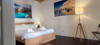 A bed or beds in a room at Liberty Futura Home