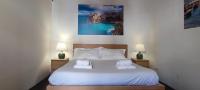 A bed or beds in a room at Liberty Futura Home
