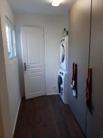 a laundry room with a door and a washing machine at Superb apartment with 108 sq ft terrace in Montreuil