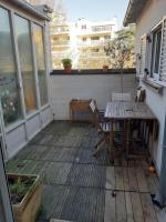 a patio with a table and chairs on a deck at Superb apartment with 108 sq ft terrace in Montreuil