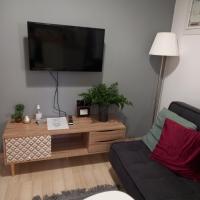 Televízia a/alebo spoločenská miestnosť v ubytovaní Eva apartment