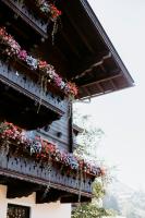 a building with flowers on the side of it at Tofererhof in Bad Hofgastein