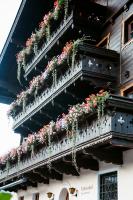 a building with flower boxes on the side of it at Tofererhof in Bad Hofgastein