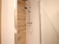 a shower with a glass door in a bathroom at Appartement La Bourboule, 3 pièces, 4 personnes - FR-1-608-261 in La Bourboule