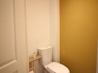 a bathroom with a white toilet in a room at Appartement La Bourboule, 3 pièces, 4 personnes - FR-1-608-261 in La Bourboule