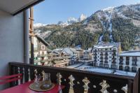 a balcony with a table and a view of a mountain at Chamonix Sud - Forclaz 304 - Happy Rentals in Chamonix