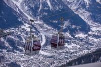 two cable cars on a ski lift in the mountains at Chamonix Sud - Forclaz 304 - Happy Rentals in Chamonix