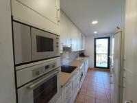 Kuchyň nebo kuchyňský kout v ubytování Apartamento con solárium en Marina Sant Jordi (MSJ81)