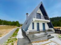 a house with a triangular roof on top of it at Villa Anemar in Blidinje