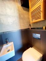 a bathroom with a toilet and a sink at Le Chaville in Cagnes-sur-Mer