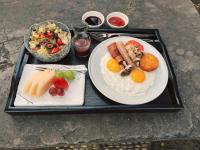 a tray with two plates of breakfast food on it at Jiangnan House Changyuan in Suzhou
