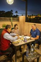a group of people sitting at a table eating at Riad Atrium & Spa in Marrakech
