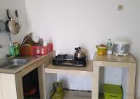 a kitchen with two counters and a sink at Bumina EENK in Bunikasin