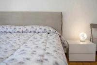Posteľ alebo postele v izbe v ubytovaní Ninfea apartments
