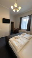 Postel nebo postele na pokoji v ubytování Hotel Boston