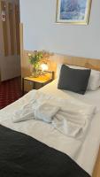 Postel nebo postele na pokoji v ubytování Hotel Boston