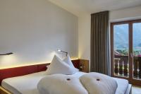 Łóżko lub łóżka w pokoju w obiekcie Hotel Obermoosburg