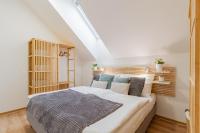 Postel nebo postele na pokoji v ubytování Apartmány Vista Klínovec