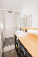 a bathroom with a sink and a shower at T3quartier Rsidentielcosyfamilleamis in Mâcon