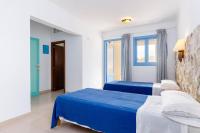 Łóżko lub łóżka w pokoju w obiekcie Hostal Marina