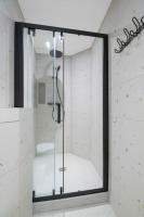 a shower in a bathroom with a mirror at 11.Appart 4pers#1 Bedroom#Pigalle#Opéra#Paris 9 in Paris