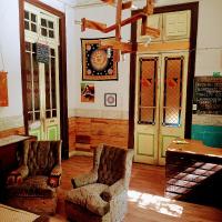 a living room with two chairs and a table at Origenes in Santiago