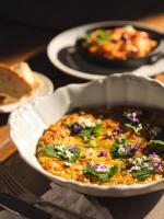 a bowl of food sitting on a table at HOTEL StDaniel in Štanjel