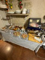 a table with many different types of food on it at 121 Paris Hotel in Paris