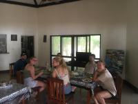 un grupo de personas sentadas en una mesa en Yasawa Long Beach Hideout Resort, en Vuake