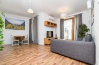 Televízia a/alebo spoločenská miestnosť v ubytovaní Landmark Apartments