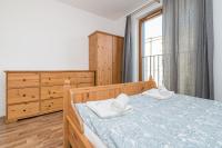 Posteľ alebo postele v izbe v ubytovaní Landmark Apartments