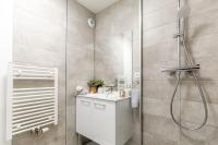 a bathroom with a shower and a sink at Grand &amp; Lumineux T2 au Coeur de Monplaisir • Métro à 2’ • Parking Privé in Lyon