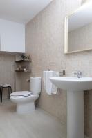 a bathroom with a toilet and a sink at Palacio de Luja in El Puerto de Santa María