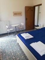 A bed or beds in a room at Residence Le Villette