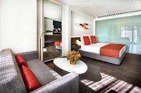 a hotel room with a bed and a couch at Olivia Balmes Hotel in Barcelona