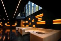 a lobby with couches and tables and a large window at Olivia Balmes Hotel in Barcelona