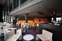 a restaurant with white tables and white chairs at Olivia Balmes Hotel in Barcelona